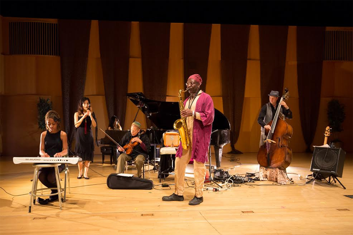 A group of musicians perform on stage.