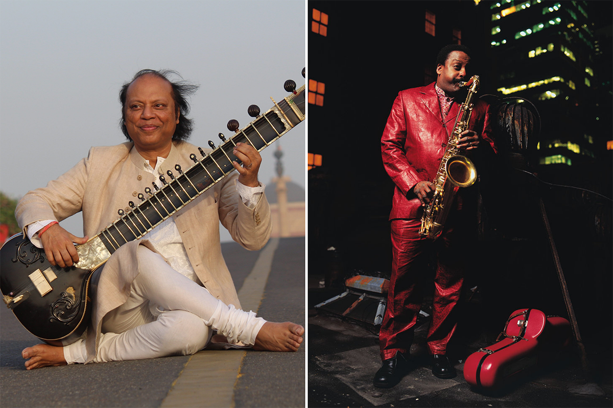 From left to right: A man sits in the road holding a string instrument, and a man dressed in red plays a saxophone.