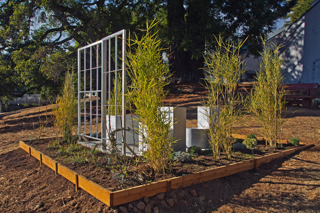 A view of the installation in the garden, based on the blueprint of a 6x9' US solitary confinement cell.