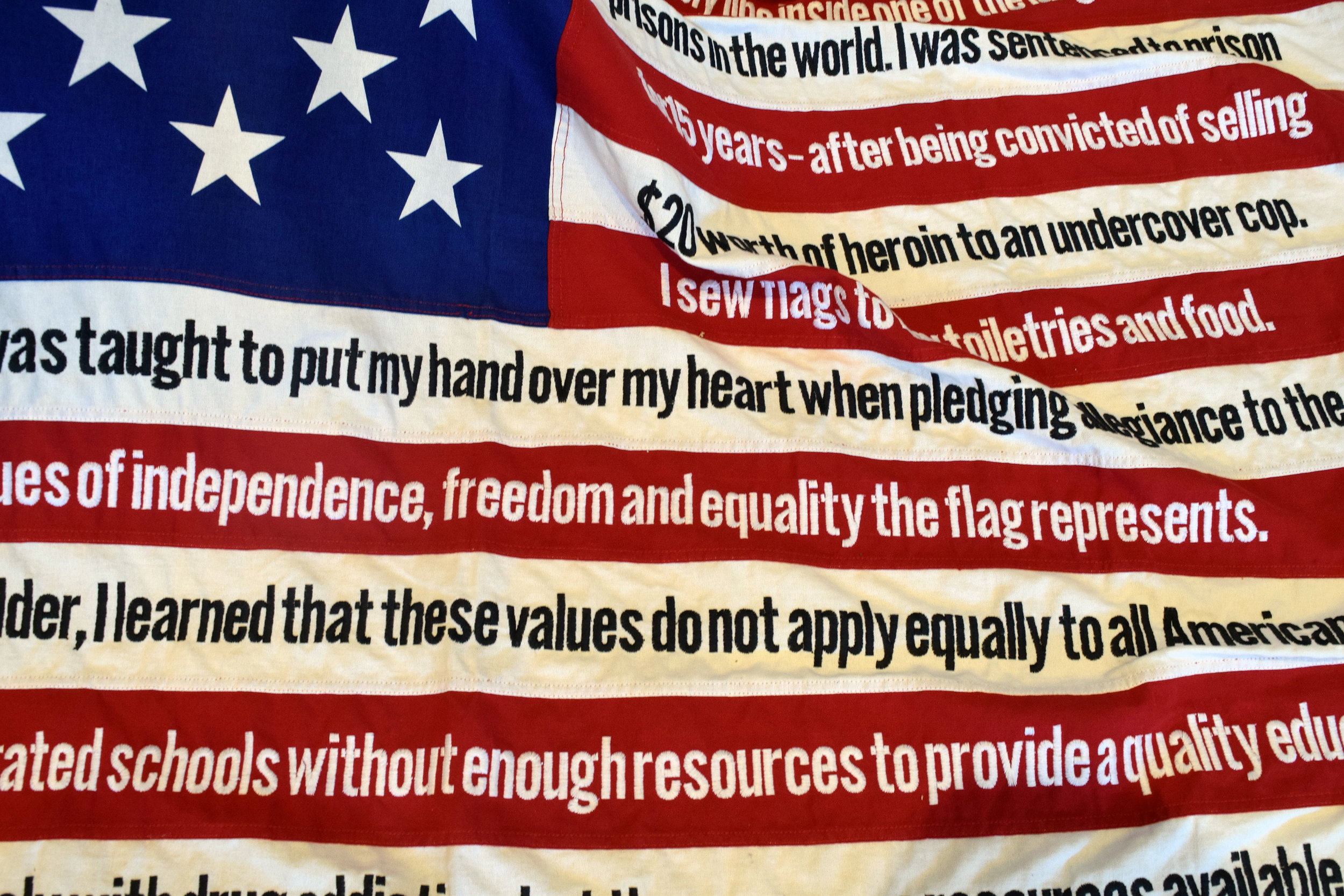 The American Flag is shown with words printed on it.