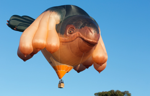 A hot air balloon in the shape of a seacreature.