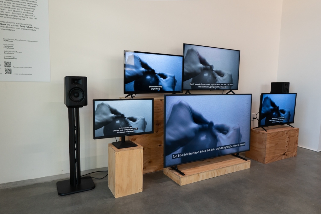 image of 5 different sized monitors on wood boxes