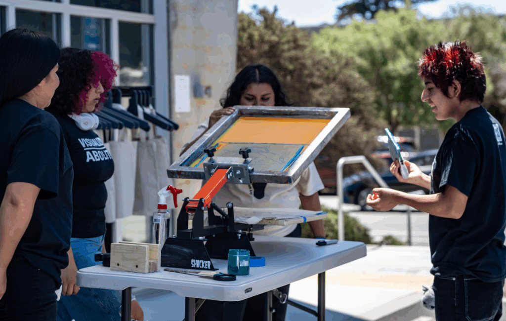 Art for All students screenprinting during their youth-led Family Day