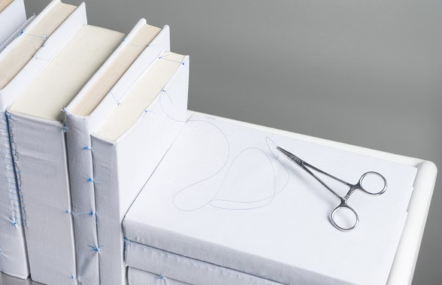 surgical scissors on book
