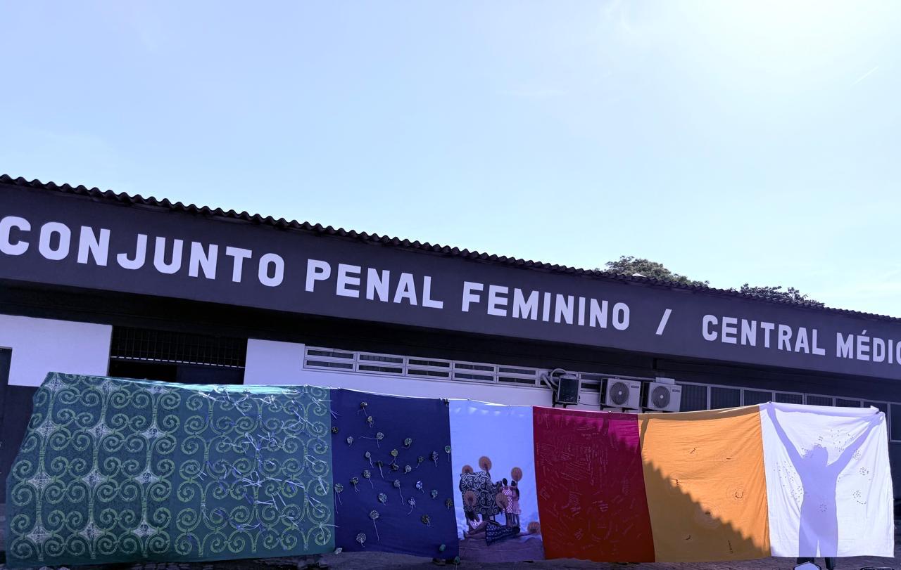 Fabric installation created in collaboration with Sisters Inside, held up outside Conjunto Penal Feminino.